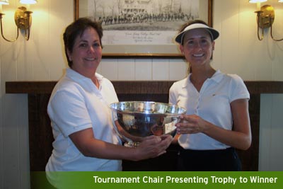 Tournament Chair Presenting Trophy to Winner